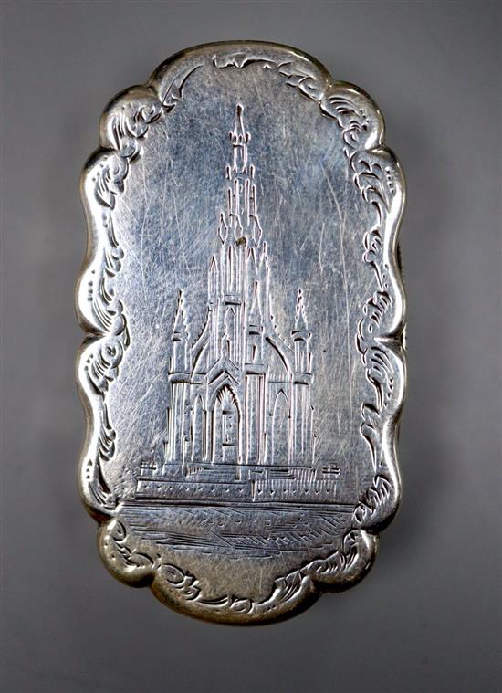 A Victorian silver shaped oval vinaigrette, engraved with the Scott Monument, Frederick Marsden, Birmingham, 1876, 47mm.